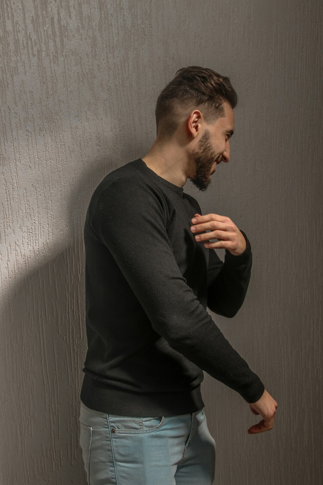 Studio portrait of a middle-aged man in a casual sweater