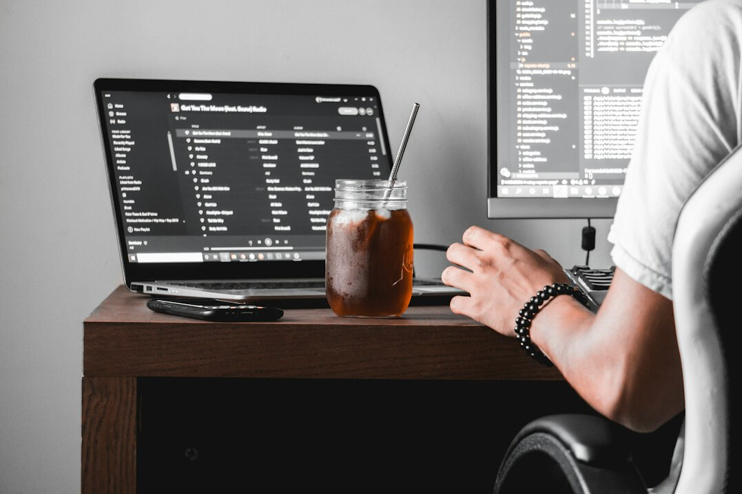 programmers coding at desk
