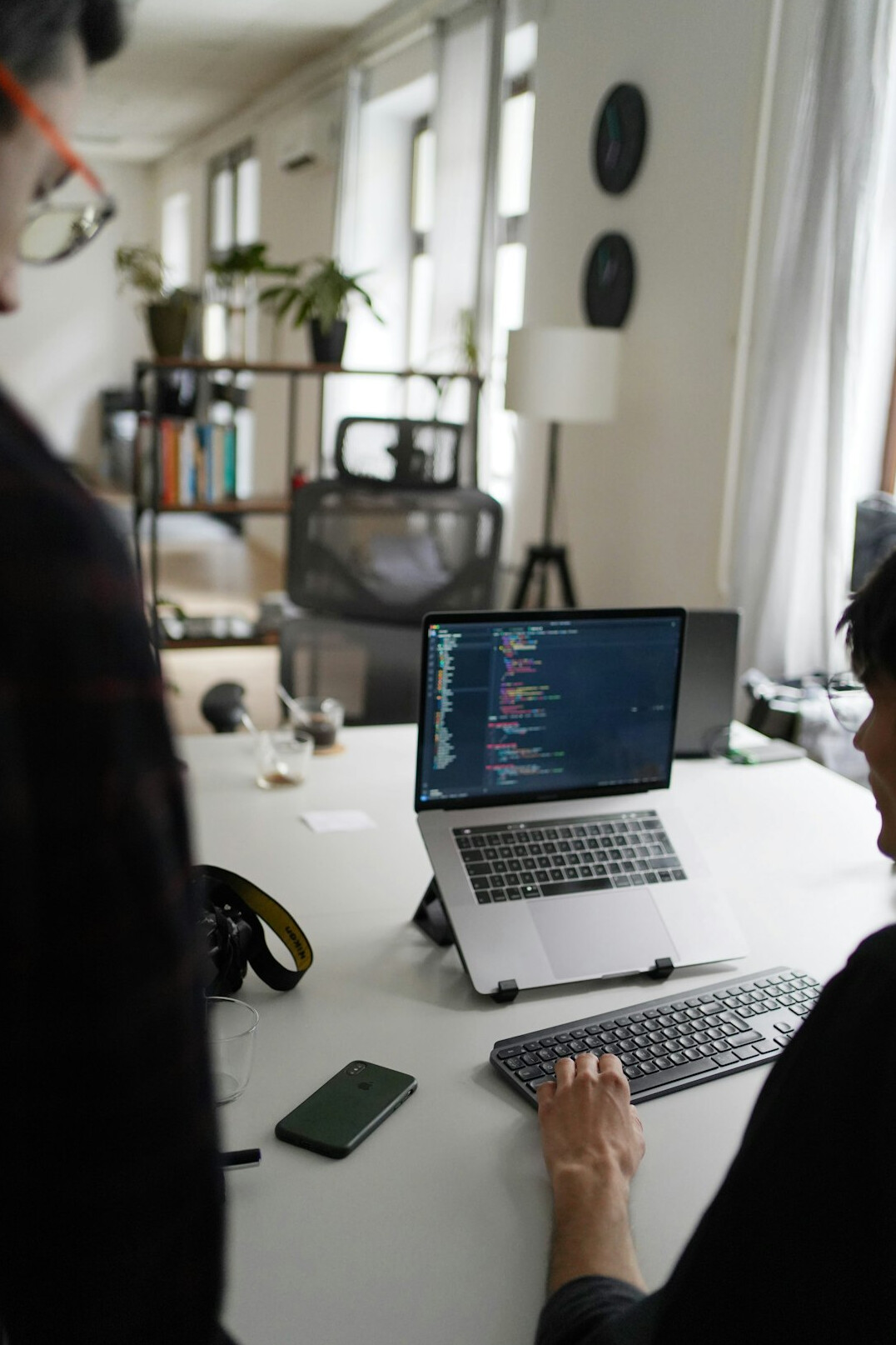 team of developers coding in office